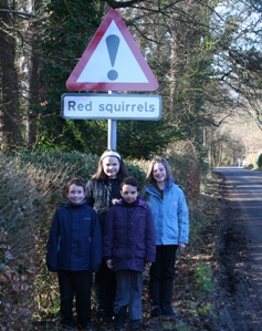 New Abbey Primary School Pupils with Red Squirrel Road Sign